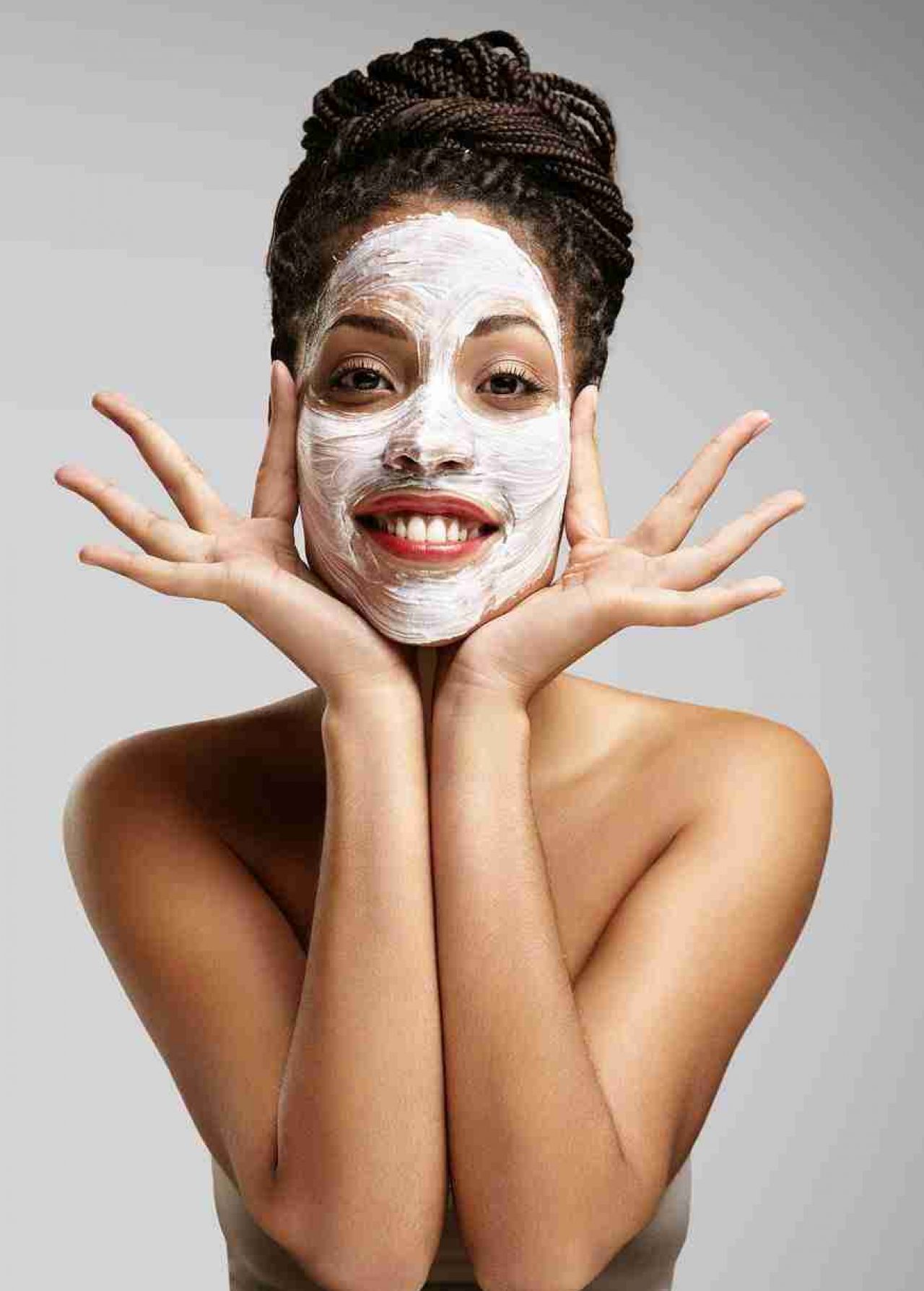 Beauty Black Woman With A Facial Mask Having Fun