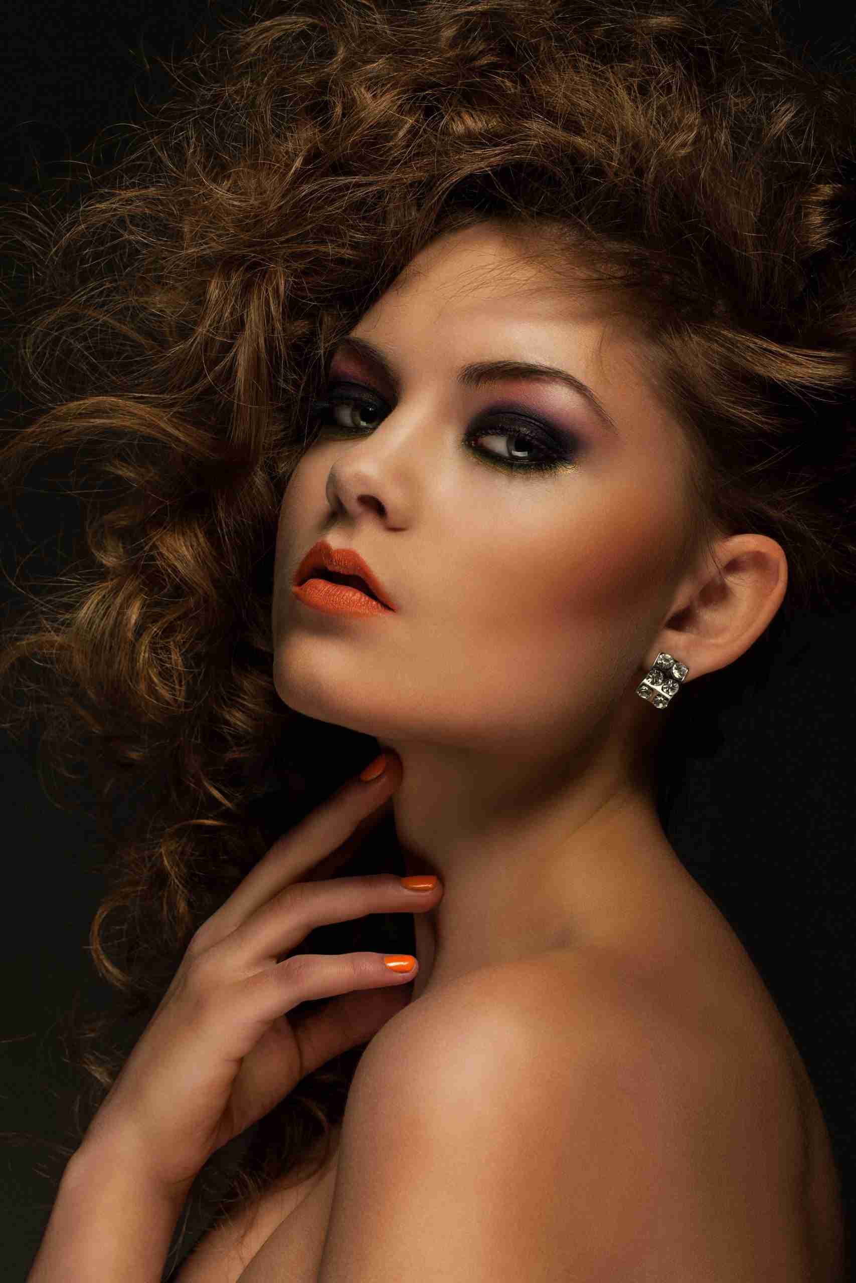 Beautiful woman with curls and makeup