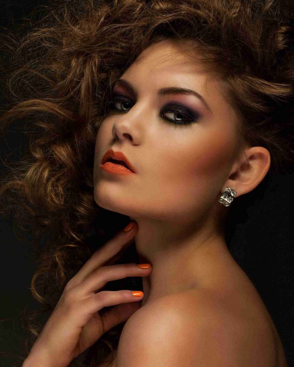 Beautiful woman with curls and makeup